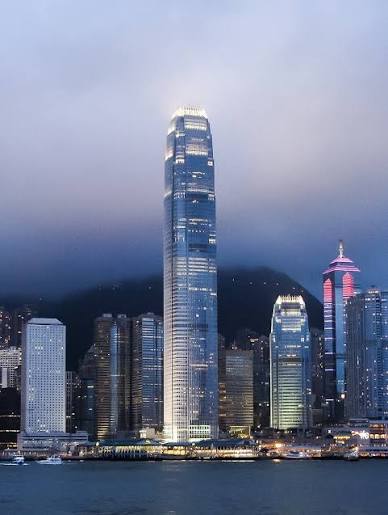 Hong Kong Central skyline seen across Victoria Harbour at dusk